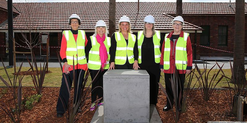 Joy Cummings’ daughter-in-law Julie Cummings and daughters Helen Cummings, Kathryn Connell and Margaret Badger with Newcastle Lord Mayor Nuatali Nelmes (centre) gather around the plinth at the former Civic Station where the statue of Joy Cummings will be installed.