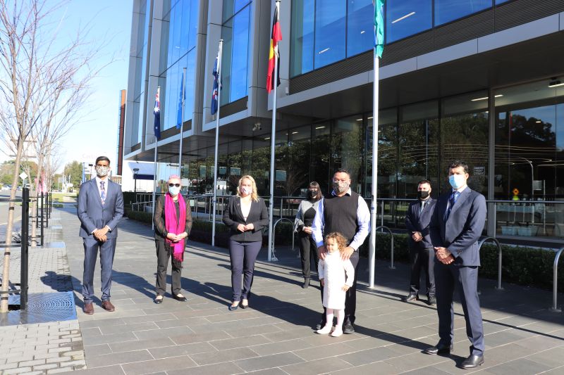 The flags were raised for the first time outside City of Newcastle's City Administration Centre today by (front L-R) 2019 Young Citizen of the Year Dr Bhavi Ravindran, Senior Citizen of the Year Jaci Lappin, Newcastle Lord Mayor Nuatali Nelmes, Citizen of the Year Professor Kelvin Kong and his four-year-old daughter Ellery, City of Newcastle CEO Jeremy Bath and (rear L-R) Community Group of the Year representatives Janice Musumeci and Evan Reid from Hamilton Business Association Inc.