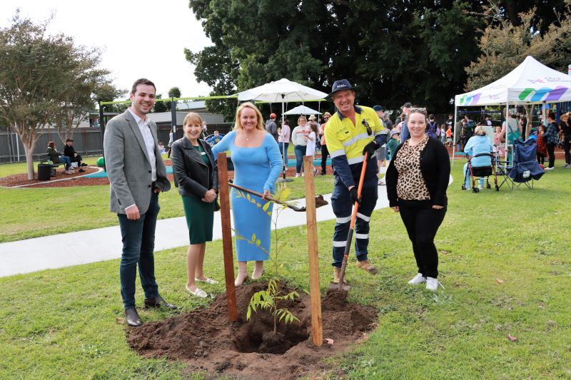 Deputy Lord Mayor Declan Clausen, Councillor Katrina Wark, Lord Mayor Nuatali Nelmes, City of Newcastle Tree Planting Officer Michael Linsley and Councillor Deahnna Richardson help plant an Australian Red Cedar at the Avon Street Reserve to mark the coronation of King Charles III.
