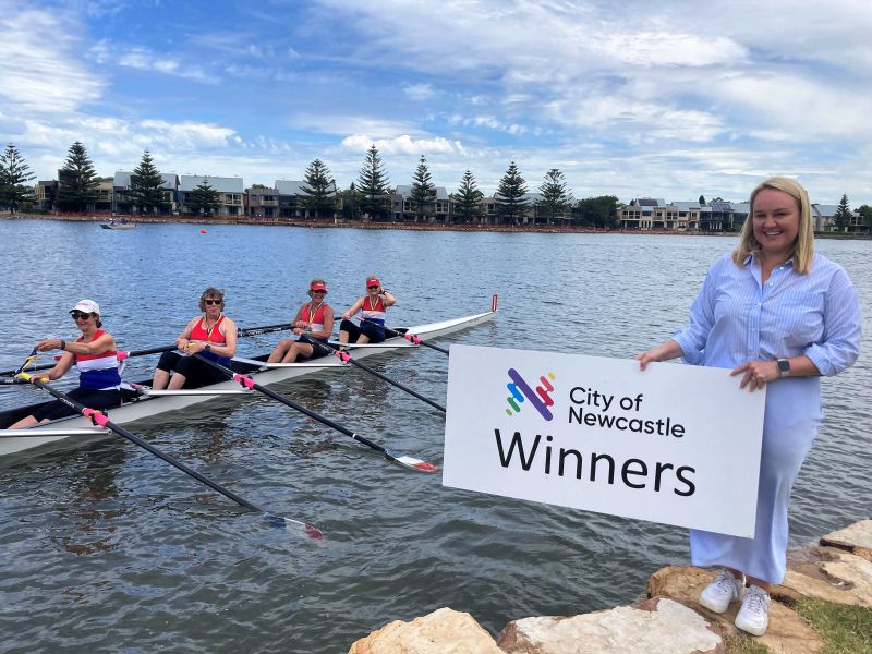 Newcastle Lord Mayor Nuatali Nelmes with one of the winning teams from Newcastle Rowing Club at the annual Central Districts Rowing Association Sprint Championships on Throsby Creek, which is part of a sizzling summer of events in Newcastle.
