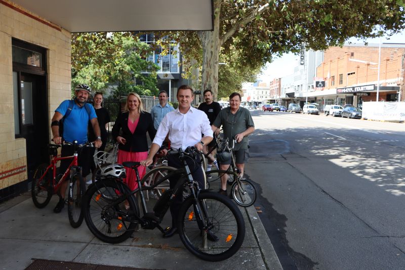 (L-R): Cyclist Johnathan Carroll, Rose van der Kloet (Metro Cycles), Lord Mayor Nuatali Nelmes, Project Planner Tim Daley, Parliamentary Secretary for the Hunter Taylor Martin MLC, Rob McCann (Metro Cycles) and Bernie Hocking (Metro Cycles) at the location where the Hunter Street West End Cycleway will commence.