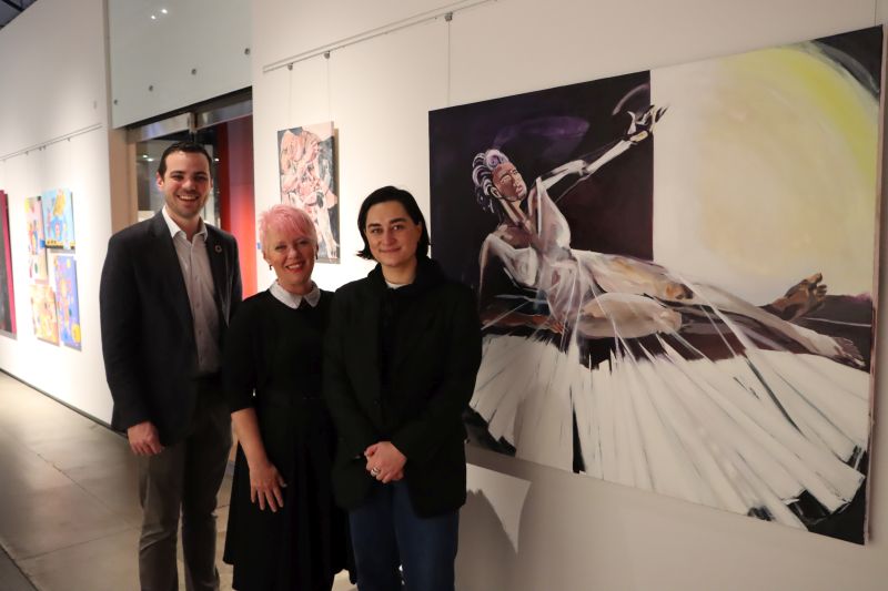 Deputy Lord Mayor Declan Clausen, Newcastle Museum Director Julie Baird and exhibition curator Jasmine Fletcher with a work titled '1955-Present' by Yvette Ten-Bohmer, which features in the new Unabbreviated exhibition.