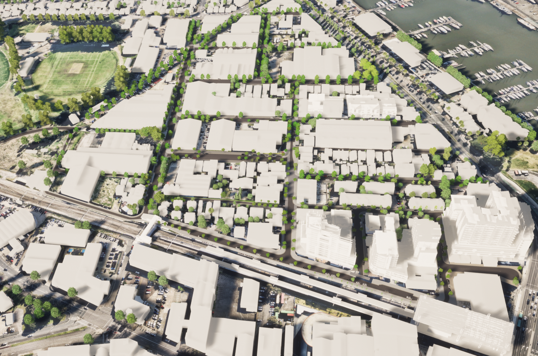 A 3D birds-eye view rendering of the Wickham area in Newcastle. There are 3D rendered buildings casting shadows. The majority of the streets are lined by trees. The railway line is running along at the bottom of the image. On the left, above the railway line are Wickham Park, surrounded by trees. Running from north to south are Railway Street, Union Street and Foundry Street. In the top right corner of the image are boats docked at Throsby Creek. 
