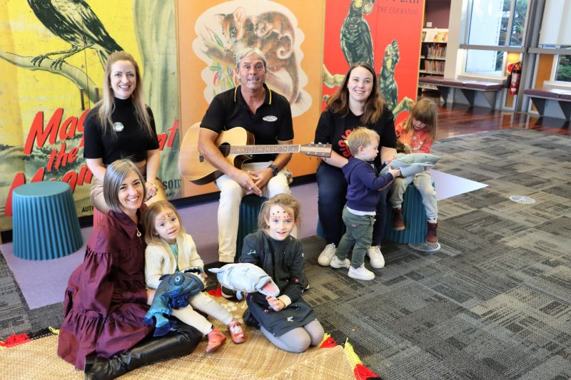 Cr Elizabeth Adamczyk, Uncle Amos Simon and Cr Deahnna Richardson with some of the participants of the first monthly Sharing Culture Storytime session held at Wallsend Library today in celebration of NAIDOC Week.