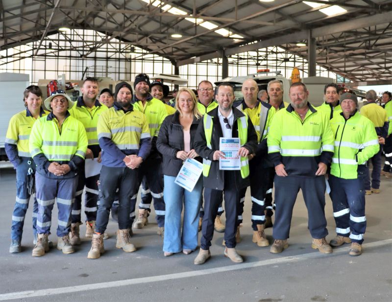 Newcastle Lord Mayor Nuatali Nelmes, USU Official Luke Hutchinson with City of Newcastle workers at the Works Depot.
